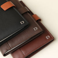 Close up view of three Danilos multifunctional leather portfolio with hidden magnet closure