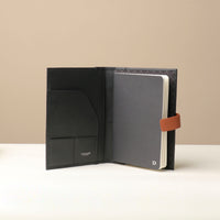 Open Danilos Nirua Small Portfolio Pebble Black/Tan leather organizer