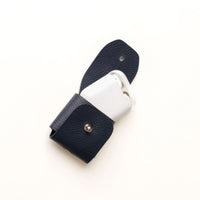 Open view of blue Airpod Case Santi Jr. leather with snap closure