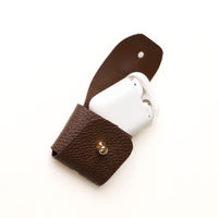 Open view of brown Airpod Case Santi Jr. leather with snap closure
