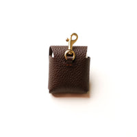Back view of brown Airpod Case Santi Jr. leather with snap closure