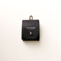 Front view of black Airpod Case Santi Jr. leather with snap closure