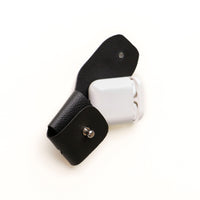 Open view of black Airpod Case Santi Jr. leather with snap closure