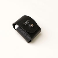 Side view of black Airpod Case Santi Jr. leather with snap closure