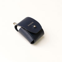 Side view of blue Airpod Case Santi Jr. leather with snap closure