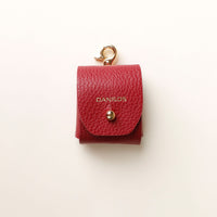 Front view of red Airpod Case Santi Jr. leather with snap closure