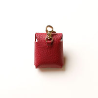 Back view of red Airpod Case Santi Jr. leather with snap closure