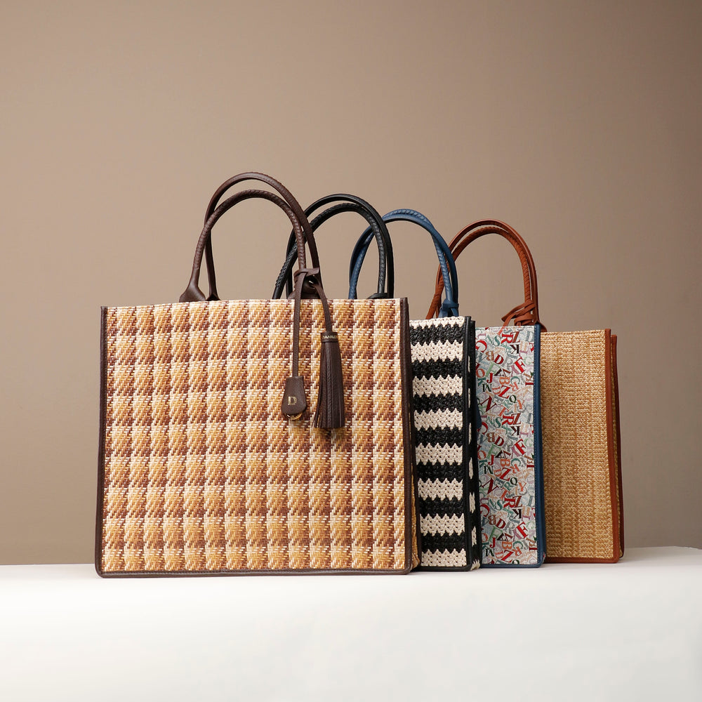 A collection of Raffia Mercatto Tote Bags in various patterns and color combinations, featuring a common design with leather details.