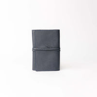 Front view of dark blue Danilos Porta Tech New Design leather cable organizer