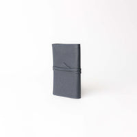 Side view of dark blue Danilos Porta Tech New Design leather cable organizer