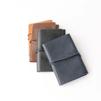 Stack of Danilos Porta Tech New Design leather cable organizer