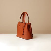 Side view of brown Premium leather Boss Bag Top Handle for organized daily carry