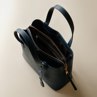 Open interior of blue Premium leather Boss Bag Top Handle for organized daily carry