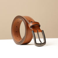 A brown leather belt with a metal buckle, displayed against a neutral background.