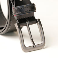 Close-up of double stitch detail on black leather belt
