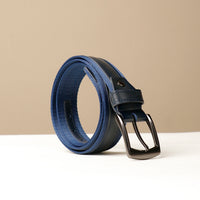 A blue canvas belt with a leather buckle and black leather strap, displayed against a neutral background.