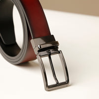 Close‑up of gradient leather finish on brown belt with buckle
