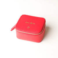 front view of a small leather Danilos Jewelry Organizer Anushka in red with embossed gold text on a white background