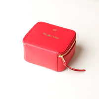 back view of a small leather Danilos Jewelry Organizer Anushka in red with embossed gold text on a white background