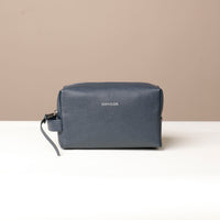Navy blue leather toiletry bag with the brand name 'Danilos' visible on the front, displayed against a neutral background.