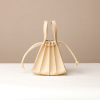 Back view of beige Mini Papillon Bag compact leather bucket bag by Danilo’s