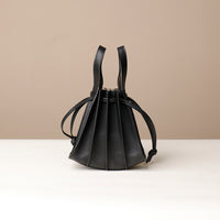 Black Mini Papillon Bag compact leather bucket bag by Danilo’s
