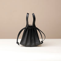 Black Mini Papillon Bag compact leather bucket bag by Danilo’s