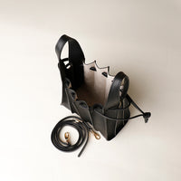 Open interior of black Mini Papillon Bag compact leather bucket bag by Danilo’s