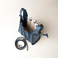 Open interior of blue Mini Papillon Bag compact leather bucket bag by Danilo’s
