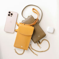 two yellow and green danilos leather multi smartphone alessia in a white background with a phone and headphones on the side