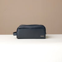 Toiletry bag Emmiliano, navy blue, handcrafted with premium leather, with visible brand Danilos, front view