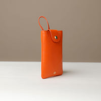 Side view of orange Leather Josephine Phone Pouch by Danilos