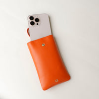 Open view of orange Leather Josephine Phone Pouch by Danilos