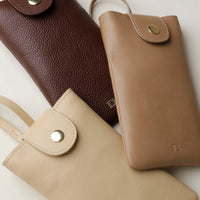 Close up view of three Leather Josephine Phone Pouch by Danilos