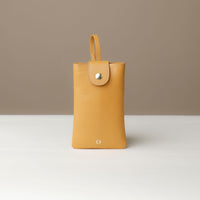 Front view of yellow Leather Josephine Phone Pouch by Danilos