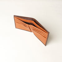 upper view of a brown pebble leather Milano wallet with a orange card case inside, 8 card slots and 2 money slots