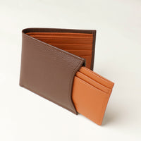 Front of a brown pebble leather Milano wallet with a orange card case holder that comes out of one of the sides