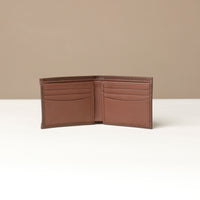 open view of a brown nappa leather Milano wallet with 8 visible slots over a beige background