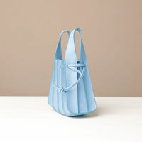 Light blue Mini Papillon Bag compact leather bucket bag by Danilo’s