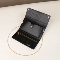 open danilos clutch versaviva in black leather with pouch for phone and card slots with gold zipper and chail