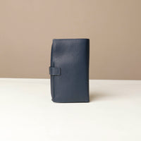 back view of a marine blue Danilos Pebble executive accessory holder linea on a beige background