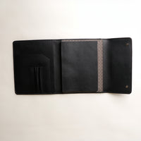 Interior view of Danilos professional black leather portfolio with compartments