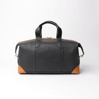 Back view of Danilos Hegarty Travel Bag Black and Brown full-grain leather with adjustable strap